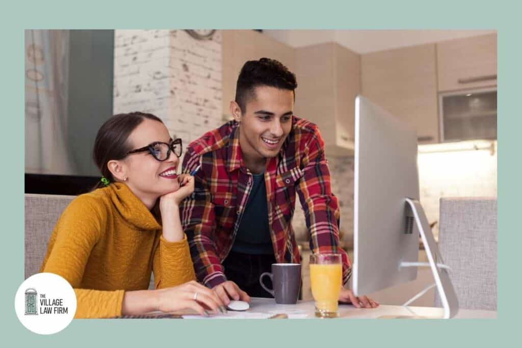 A couple reviewing their beneficiary designations online