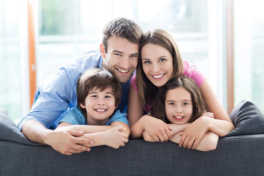 Family relaxing on sofa