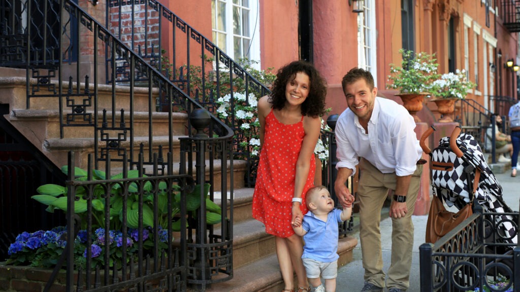 Parent signing estate planning documents in Brooklyn home