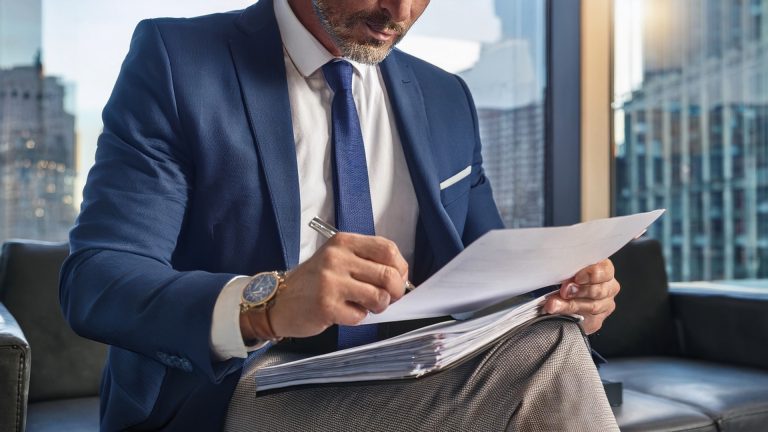 Estate planning attorney reviewing beneficiary forms in NYC