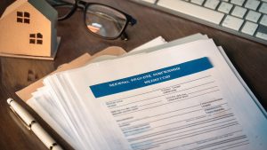 Estate planning documents for NYC renters on a desk