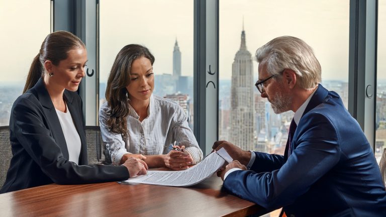Family reviewing will documents with a New York lawyer.