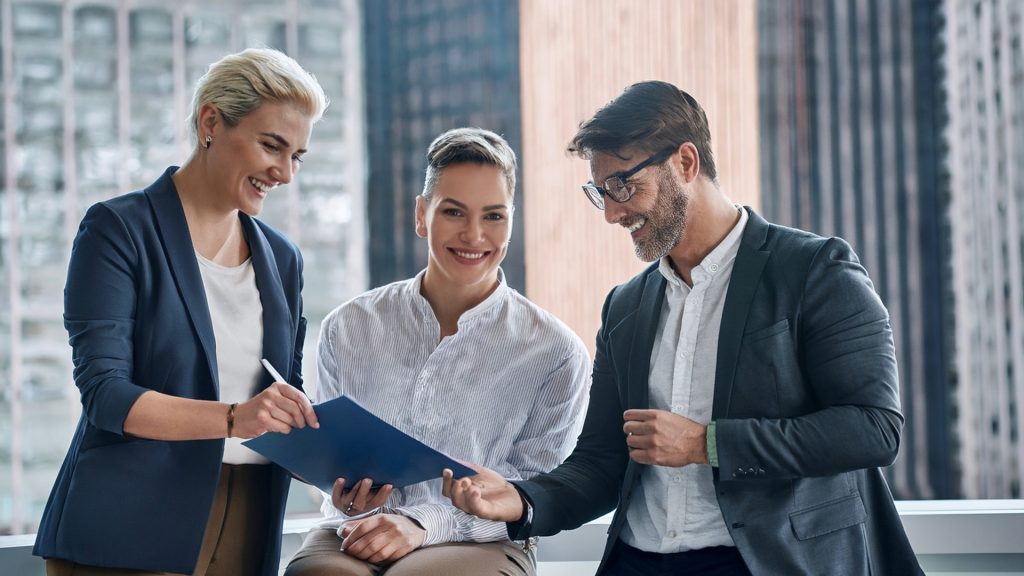 Estate planning attorney in New York reviewing documents with LGBTQ couple